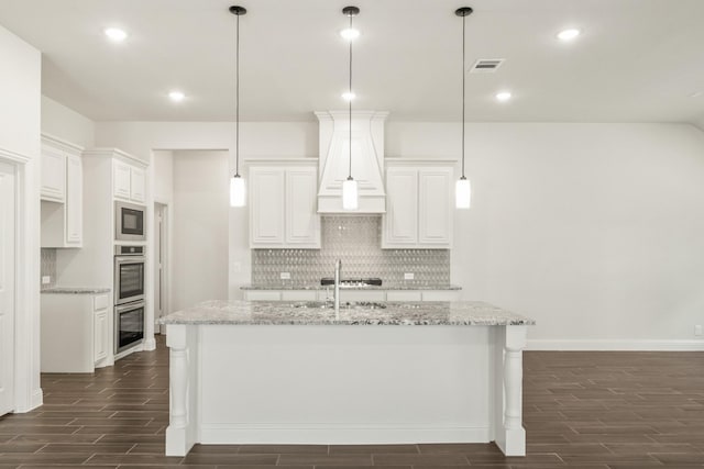 1317 Wrenwood Ct, Red Oak, TX 75167 - kitchen featuring wood finish floors, backsplash, a sink, white cabinets, and recessed lighting
