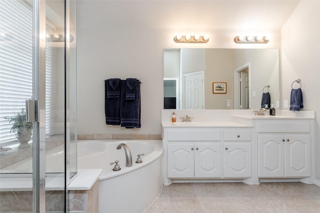 bathroom with tile patterned flooring, vanity, and plus walk in shower