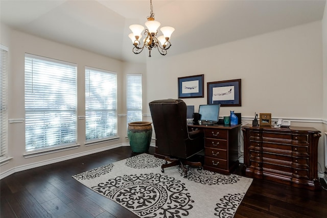 office featuring dark hardwood / wood-style floors and an inviting chandelier