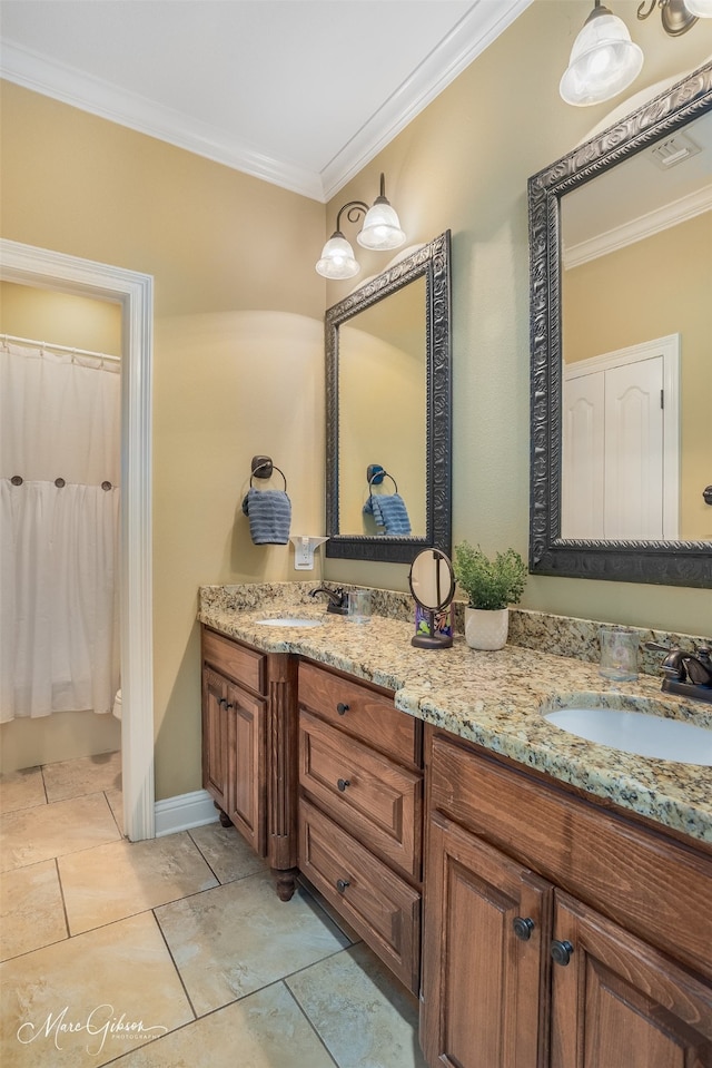 bathroom with crown molding, tile patterned flooring, and vanity