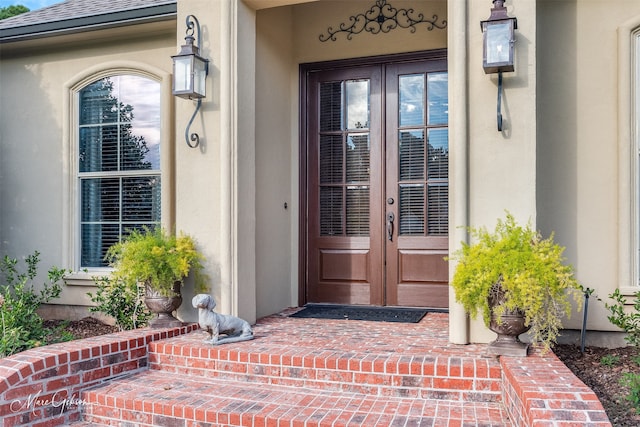 property entrance featuring french doors