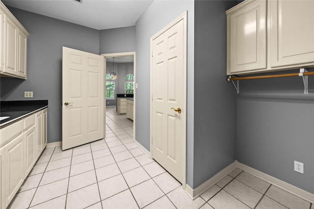 washroom with light tile patterned floors