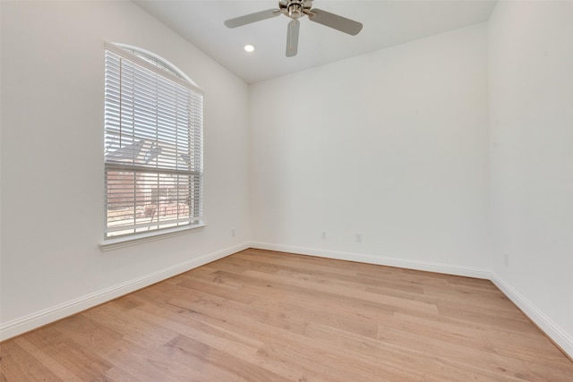 spare room with light wood-type flooring and ceiling fan