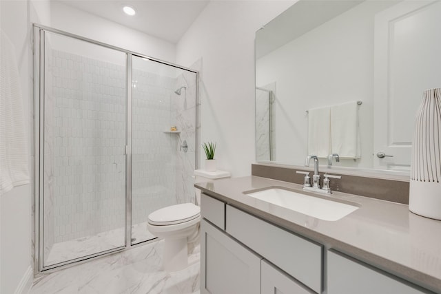 bathroom featuring vanity, an enclosed shower, and toilet