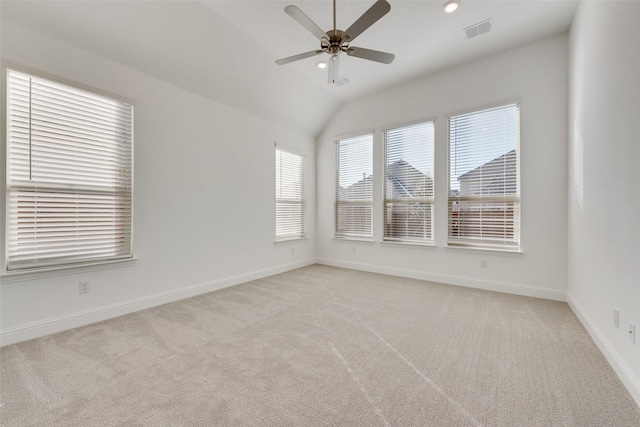 unfurnished room with ceiling fan, light colored carpet, and lofted ceiling