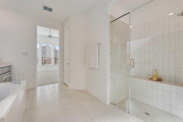 bathroom featuring tile patterned floors, ceiling fan, vanity, and plus walk in shower