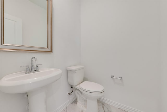 bathroom with toilet and sink