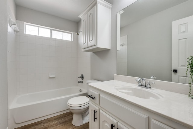 full bathroom with wood-type flooring, vanity, toilet, and tub / shower combination