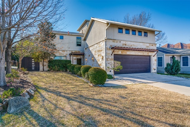 front facade with a garage and a front lawn