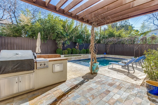 view of patio with area for grilling, a fenced in pool, and a pergola