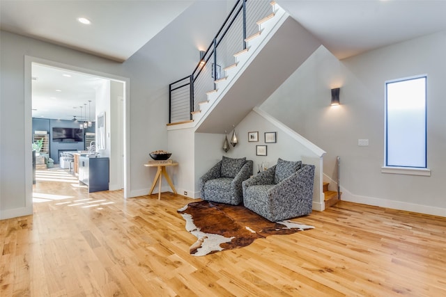 8715 Rexford Dr, Dallas, TX 75209 - sitting room featuring baseboards, stairs, and wood finished floors