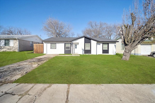 ranch-style house featuring a front lawn