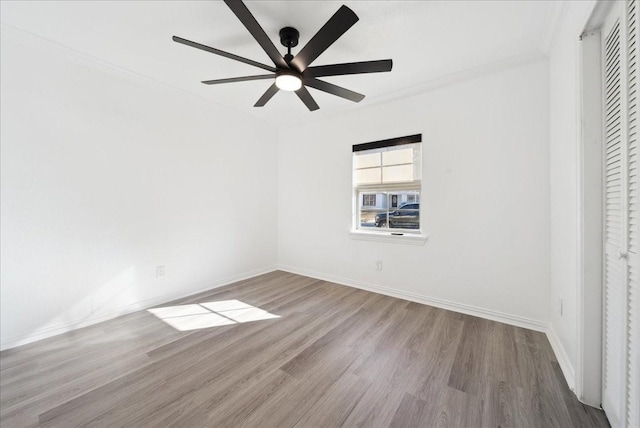 unfurnished bedroom with ceiling fan, ornamental molding, and light hardwood / wood-style flooring