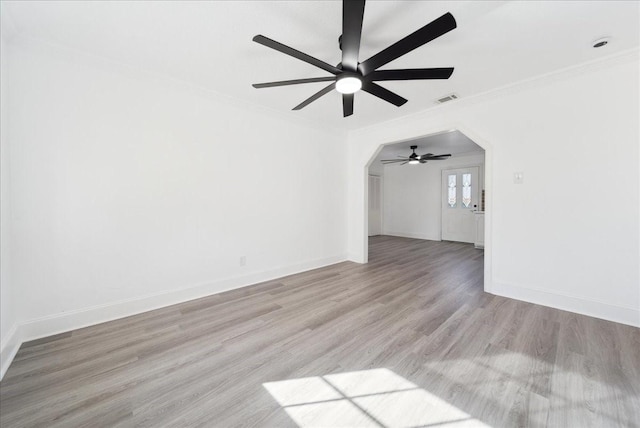 unfurnished living room with ceiling fan, light hardwood / wood-style floors, and ornamental molding