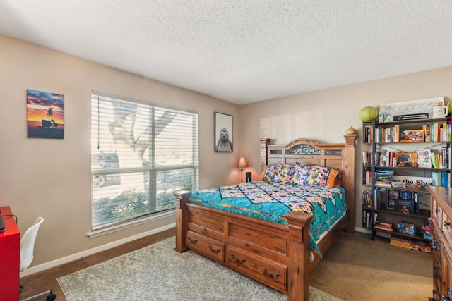 bedroom featuring carpet flooring, a textured ceiling, and multiple windows