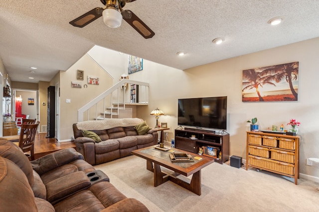 9728 Amberton Pkwy, Dallas, TX 75243 - living room with stairs, ceiling fan, baseboards, a textured ceiling, and recessed lighting