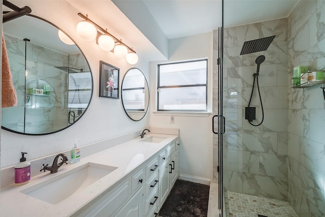 bathroom featuring vanity and a shower with shower door