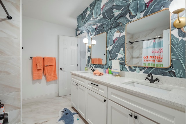 bathroom featuring vanity and curtained shower