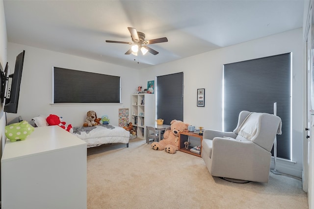 carpeted bedroom with ceiling fan