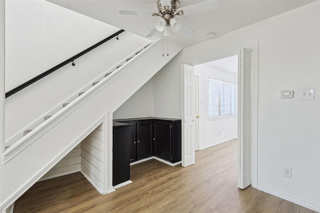 additional living space with ceiling fan and hardwood / wood-style flooring