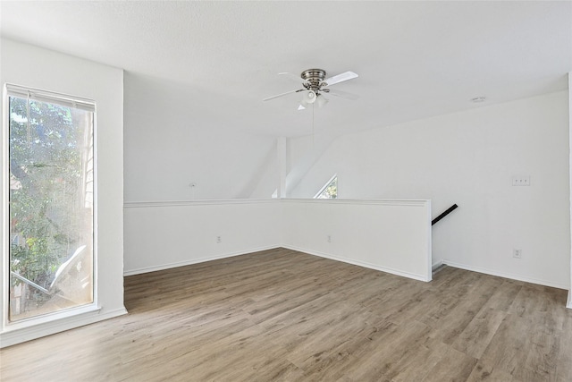 spare room with ceiling fan and light hardwood / wood-style flooring