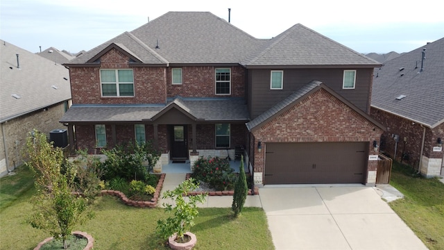 view of front of house featuring a garage and a front yard