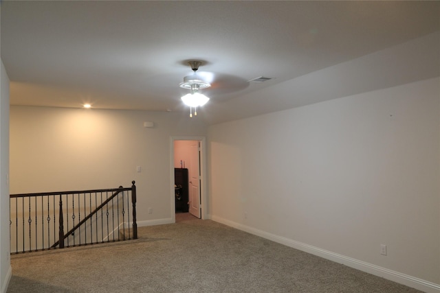 carpeted empty room with ceiling fan