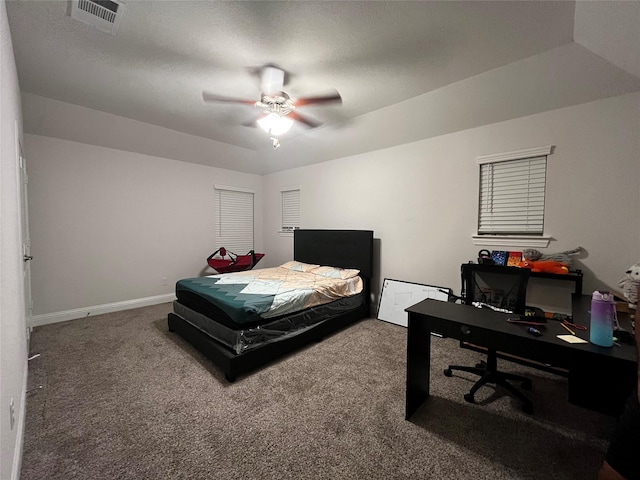 carpeted bedroom featuring ceiling fan and vaulted ceiling