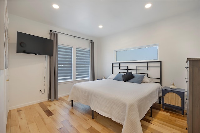 bedroom with light hardwood / wood-style floors