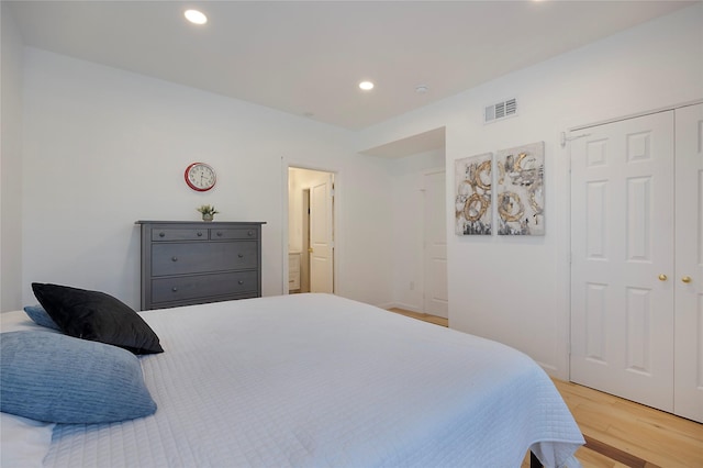 bedroom featuring a closet and hardwood / wood-style flooring