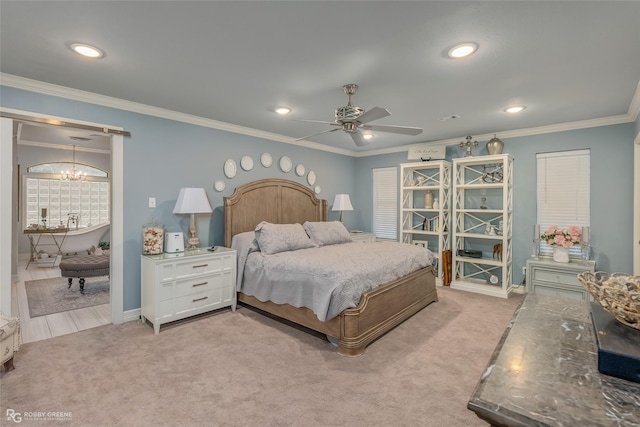 carpeted bedroom with ceiling fan with notable chandelier and crown molding