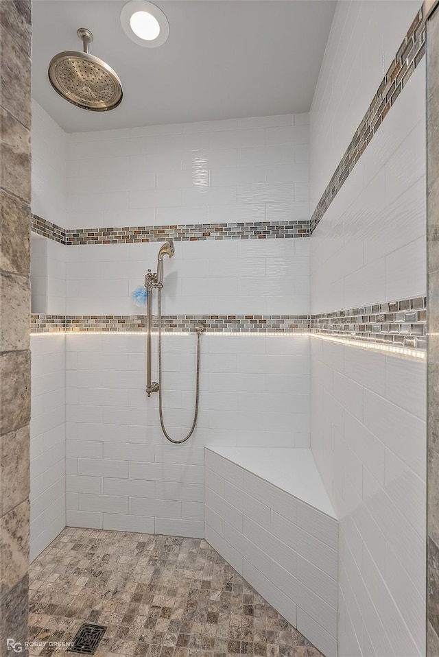 bathroom with a tile shower