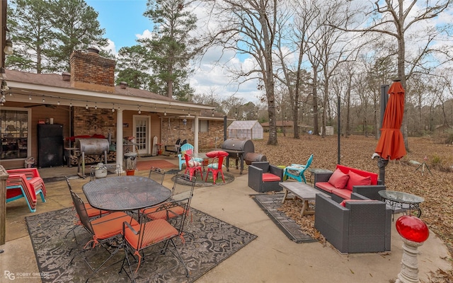 view of patio / terrace featuring outdoor lounge area and grilling area