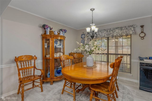 dining space featuring ornamental molding and a notable chandelier