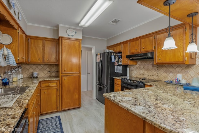 kitchen with electric range, decorative backsplash, refrigerator, and hanging light fixtures