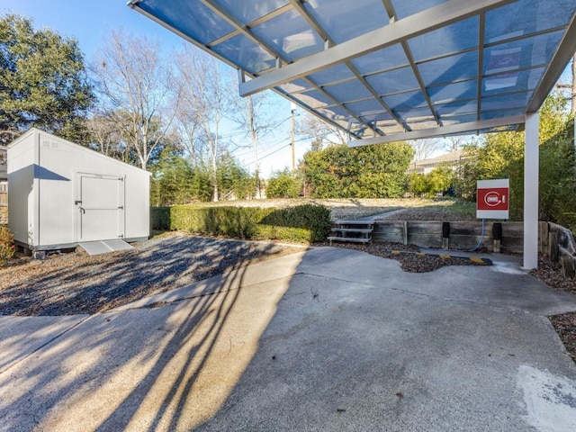 view of patio / terrace with a pergola and a shed