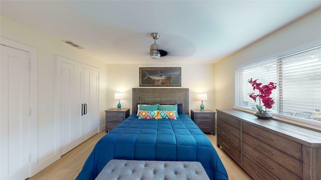 bedroom with ceiling fan and light hardwood / wood-style floors