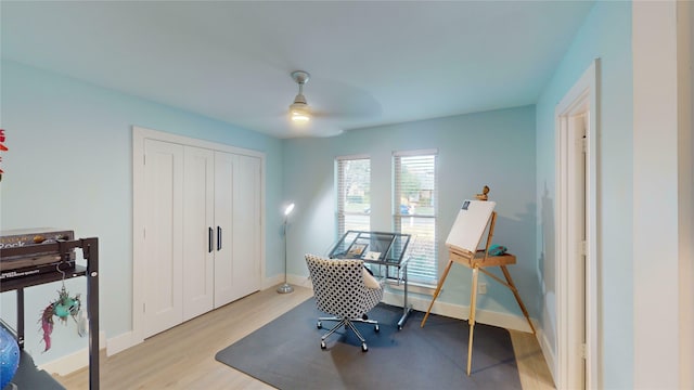 office space with ceiling fan and light wood-type flooring