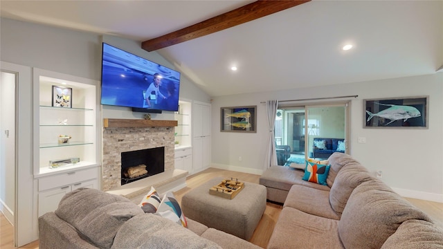 living room featuring a stone fireplace, light hardwood / wood-style flooring, lofted ceiling with beams, and built in shelves