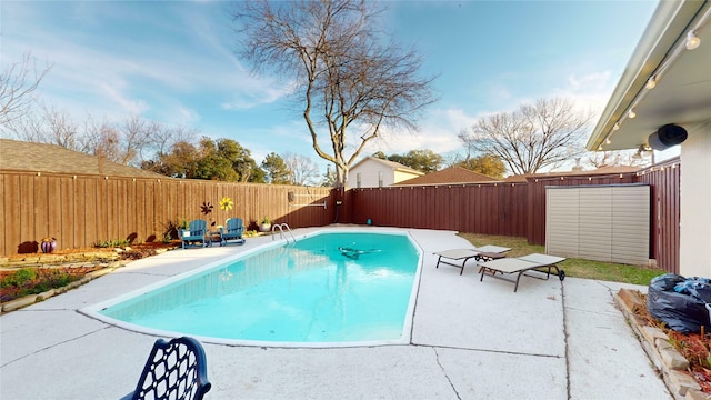 view of swimming pool with a patio