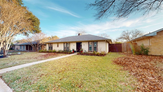 ranch-style house with a front yard