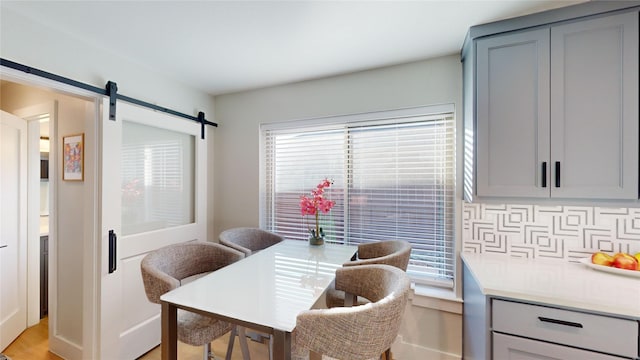 dining space with a barn door