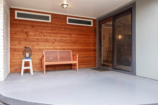 doorway to property with a patio area