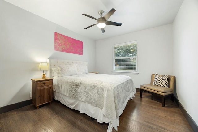 bedroom with ceiling fan and dark wood-type flooring