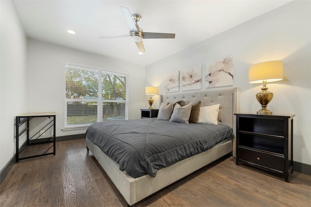 bedroom featuring ceiling fan and dark wood-type flooring