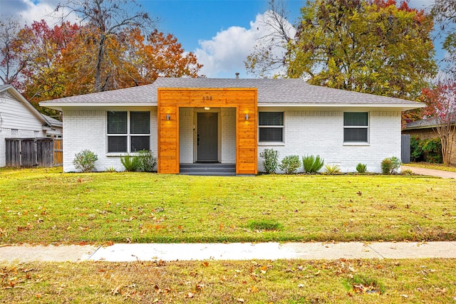 ranch-style home with a front yard