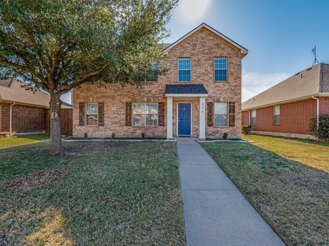 view of front of home with a front lawn