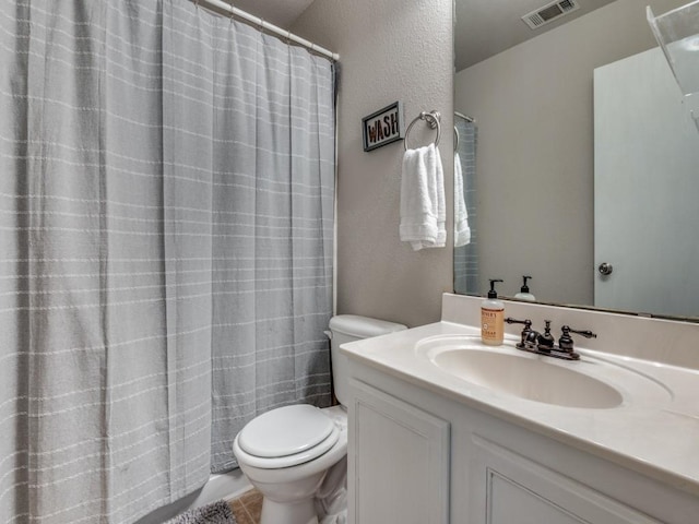 bathroom with tile patterned floors, vanity, and toilet