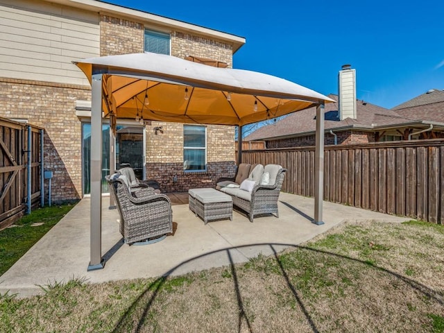 view of patio featuring a gazebo and an outdoor hangout area