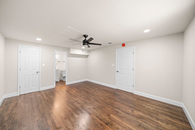 basement with dark hardwood / wood-style flooring and ceiling fan